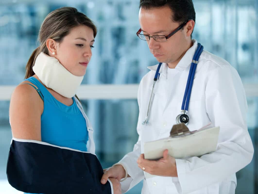 Woman working with a specialist for treatment after a car accident