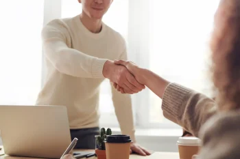 Handshake between a client and his attorney after a car accident