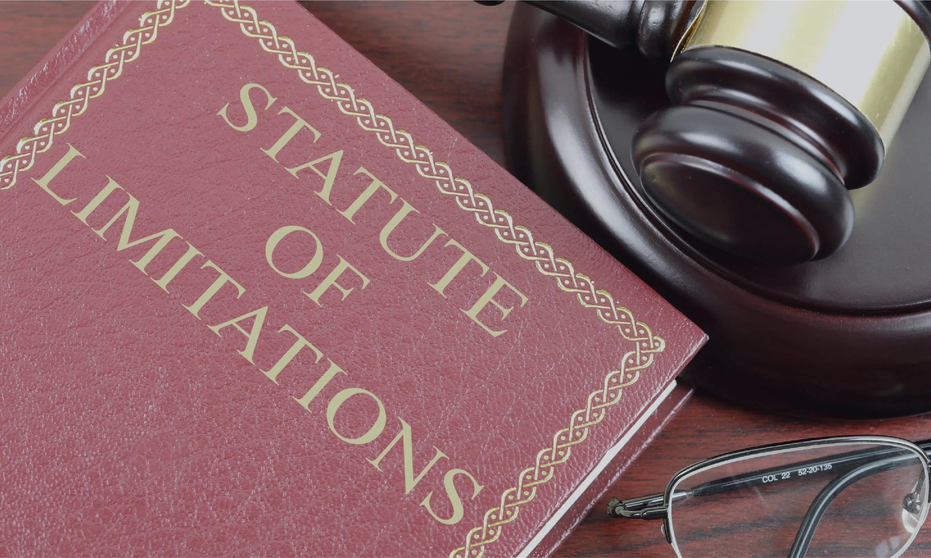 Gavel, glasses and law book on statute of limitations