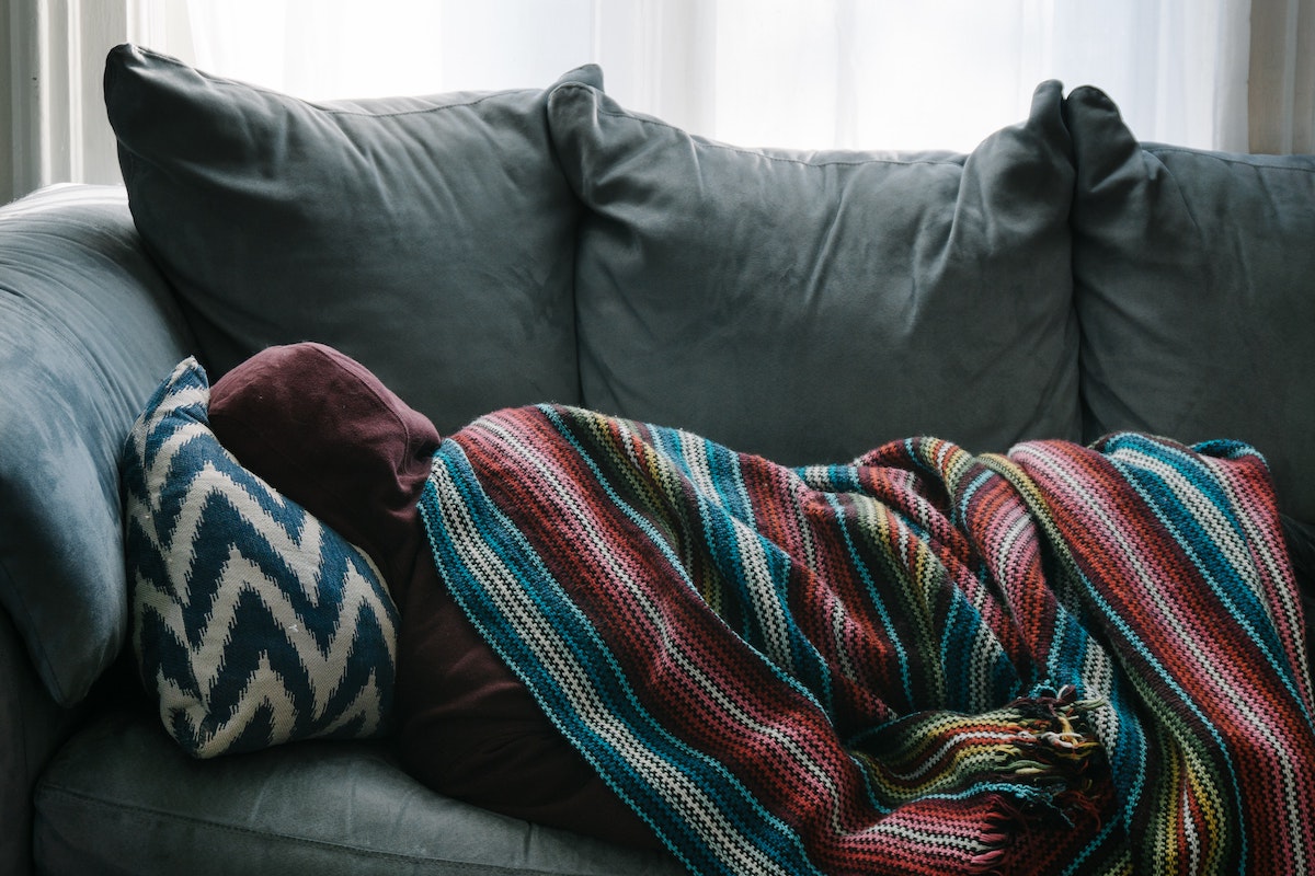 Person on a couch recovering from concussion