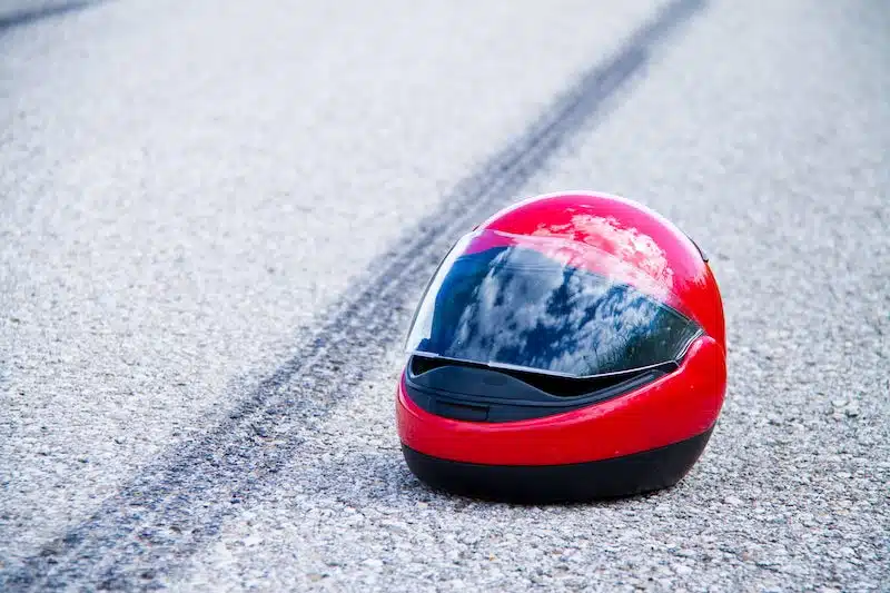 Red Motorcycle Helmet On The Ground