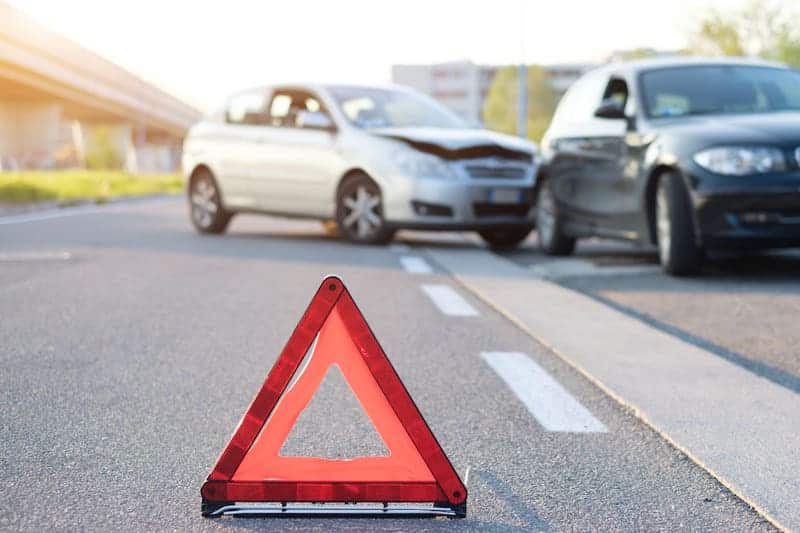 Safety Triangle Set Near A Car Crash