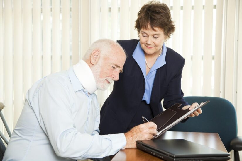 Older Man With A Neck Cast Signing Legal Paperwork