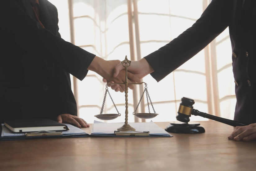 Lawyer shaking hands with a client
